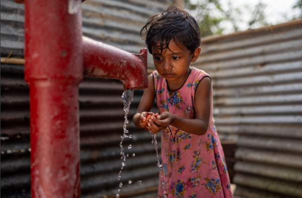 Child drinking water in Bangladesh